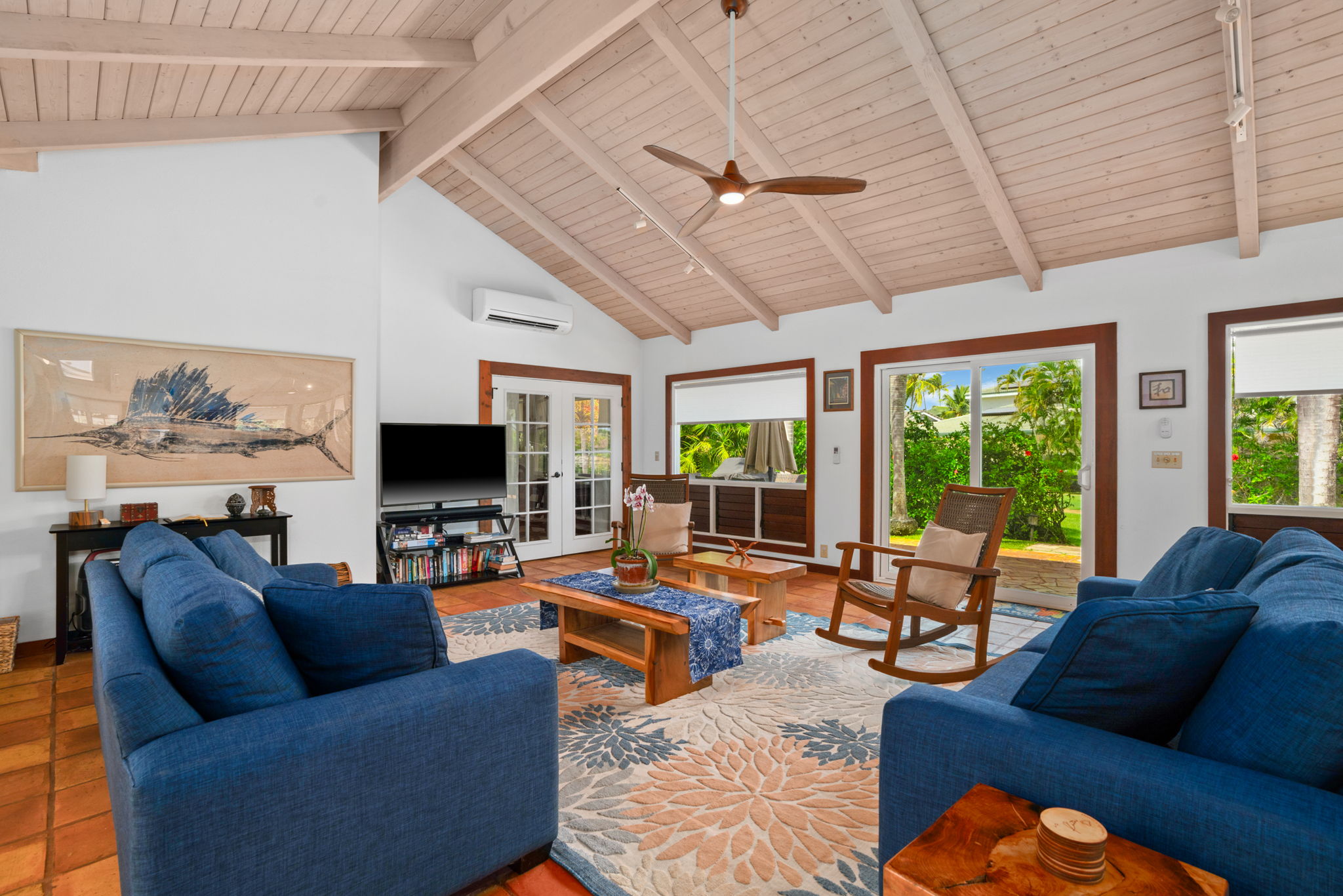 Living room: Comfortable lounge with tile floors and garden light