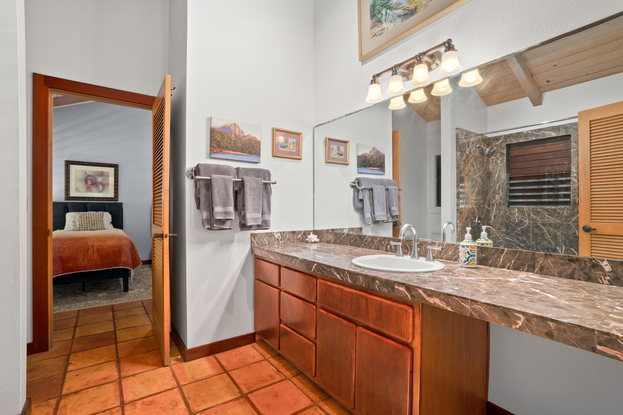 Jack-and-jill bath: Full bathroom shared between guest rooms